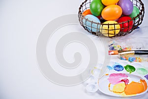 Design concept - Preparing for Easter celebration, painting Easter eggs with colorful Acrylic pigment color dyestuff in palette,