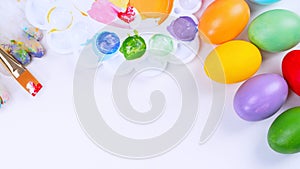 Design concept - Preparing for Easter celebration, painting Easter eggs with colorful Acrylic pigment color dyestuff in palette,