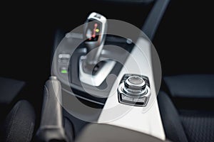 Design details of minimalist modern car - close-up details of automatic transmission and buttons