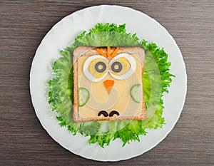 Design food. Creative sandwich for child with picture little ow