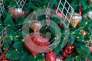 Design of a green Christmas tree decorated with lights Beautiful gift boxes and balls for celebrating Christmas holidays in winter