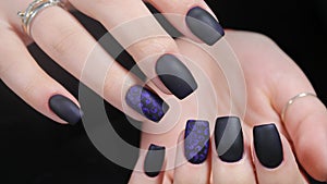 Design of manicure matt black and blue nails