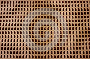 Design of pattern buddha on wall in temple .