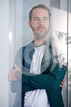 Design, thinking and arms crossed with architect man in glass boardroom of office for design. Future, planning and