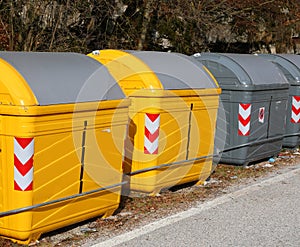 designated area with numerous bins for sorting recyclable materials photo