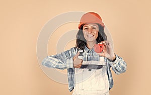 Designed to preform. technician working using tape measure tool. safety uniform. equipment for repairing. mechanic girl