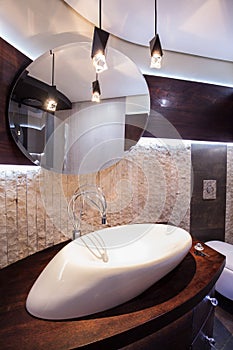 Designed washbasin in modern bathroom