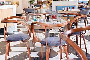 Designer chairs made of bent plywood in the interior of the cafe