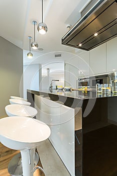 Designer chairs in modern kitchen