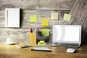 Designer desktop with laptop closeup