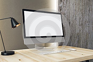 Designer desktop with white computer