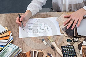 Designer draws a house design with a choice