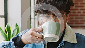 Designer, drinking coffee and thinking by window in cafe or restaurant of creative startup ideas, small business or