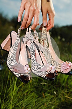 Designer fashionable eco leather women`s heels sandals shoes on mirror