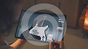 Designer making 3D prototype of guitar