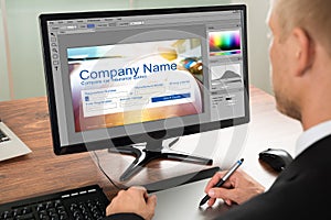 Designer Making Webpage Design On Computer