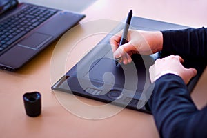 Designer with pen tablet
