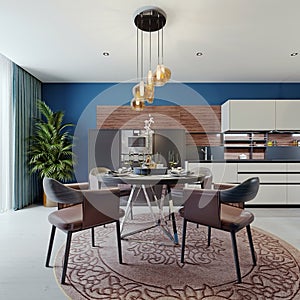 Designer round dining table with four chairs and a chandelier above the table in the interior of a modern kitchen