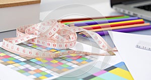 Designer's table with blank note and tools photo