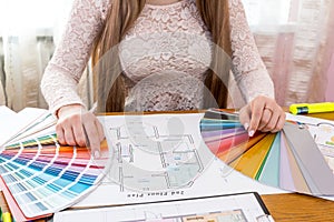 Designer showing colour swatch, choose colour for renovation