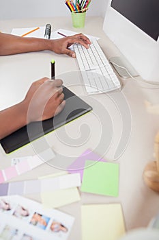 Designer sketching on graphics tablet