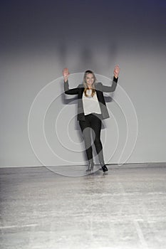 Designer Stefania Bandiera acknowledges the applause of the audience after the Les Copains show