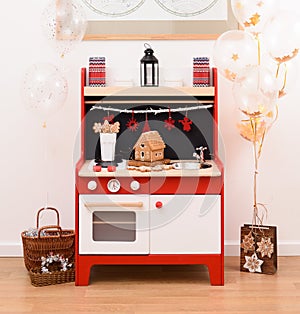 Designer toy kitchen. Black, red and white toy kitchen decorated