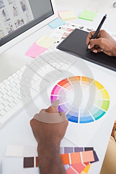 Designer using colour wheel and digitizer