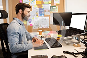 Designer using digitizer and stylus on creative office desk photo