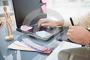 Designer using laptop and digitizer