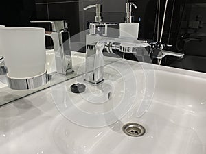 Designer washbasin in the black bathroom