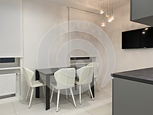 Designer white kitchen with tv