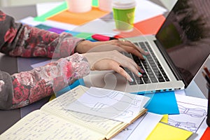 Designer working at desk using digitizer in his office