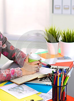 Designer working at desk using digitizer in his office