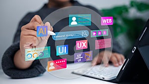 Designer working on tablet with UI UX AI web development technology interface concept