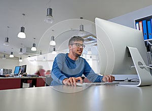 Designer young man working with computer