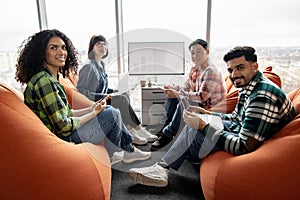 Designers devising plan using sketches and technologies