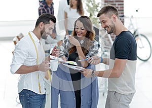 Designers discussing the design of the male suit