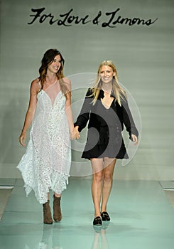 Designers Tess Hamilton and Ali Hoffmann walk the runway finale during For Love and Lemons Spring Summer 2017 Runway Show