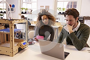 Designers Working With 3D Printer Refining Design