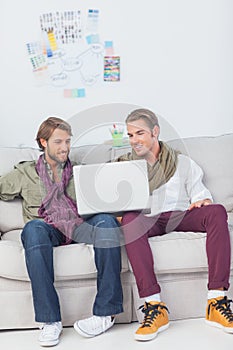 Designers working together with a laptop