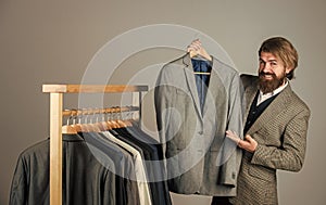 Designing new clothes. businessman. confident tailor designing male jacket. handsome sartor with tape measure. male photo