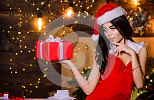 Desirable Santa girl. Gift for adults. Sexy gift. Sex shop. Attractive girl in erotic lingerie hold gift box. Woman with photo