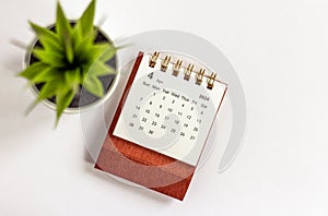 Desk calendar for April 2024 on a white background.