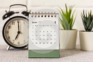 Desk calendar June 2024 on your desk for planning.