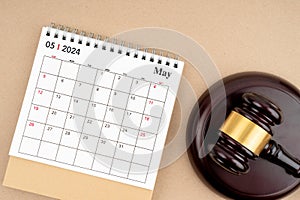 Desk calendar for May 2024 and judge\'s gavel