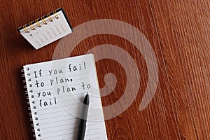 Desk calendar and notebook with quotes IF YOU FAIL TO PLAN, YOU PLAN TO FAIL