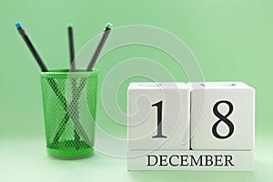 Desk calendar of two cubes for December 18