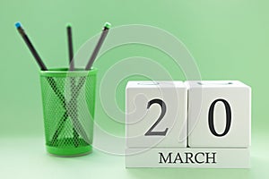 Desk calendar of two cubes for March 20