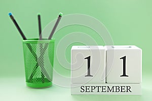 Desk calendar of two cubes for September 11